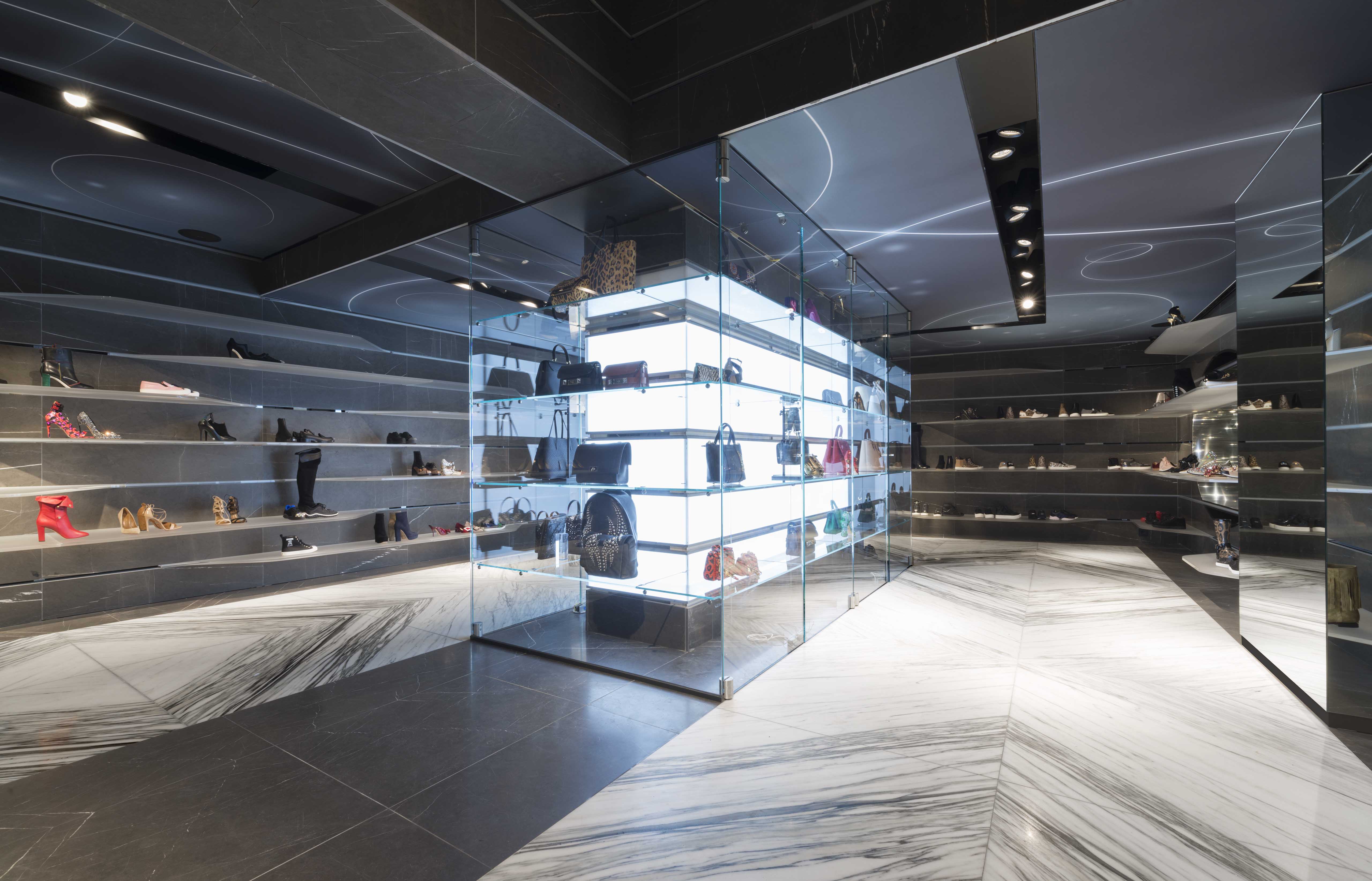 Dark marble and glass Shoebaloo store interior with illuminated central display