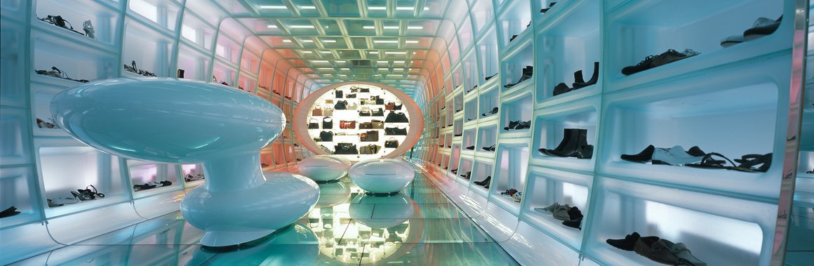 Futuristic Shoebaloo interior with illuminated shelves and glossy floor