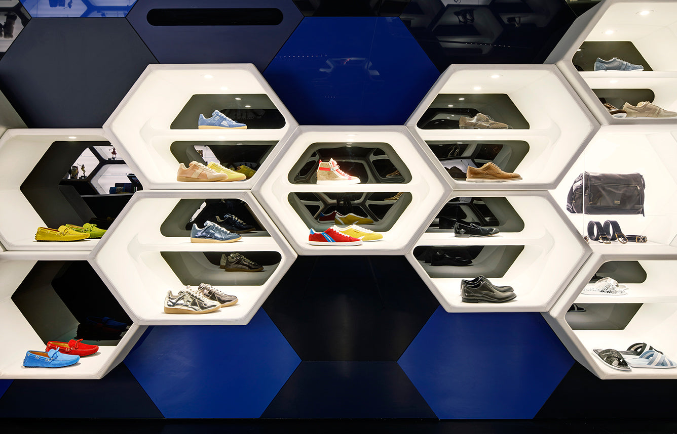 Shoebaloo store interior with hexagonal blue and white display wall